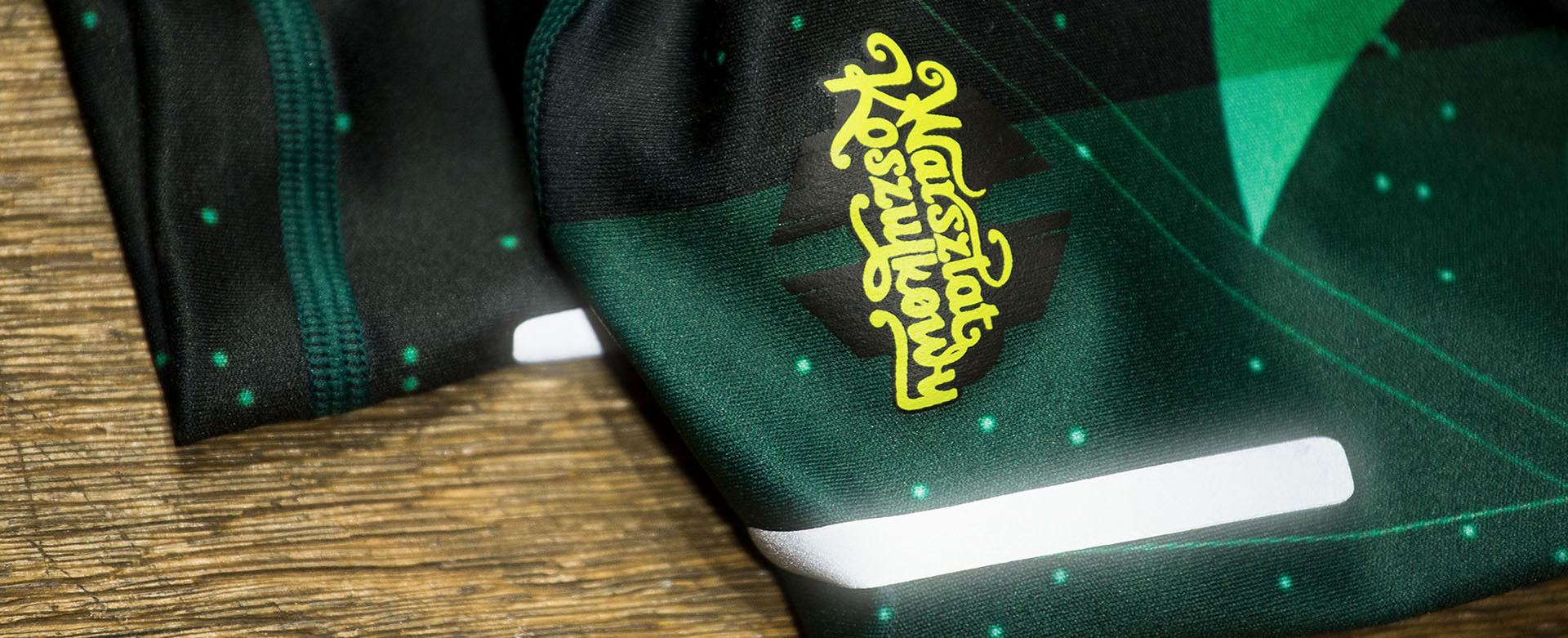 Green sublimated sleeve with reflective strip and Warsztat Koszulkowy logo print